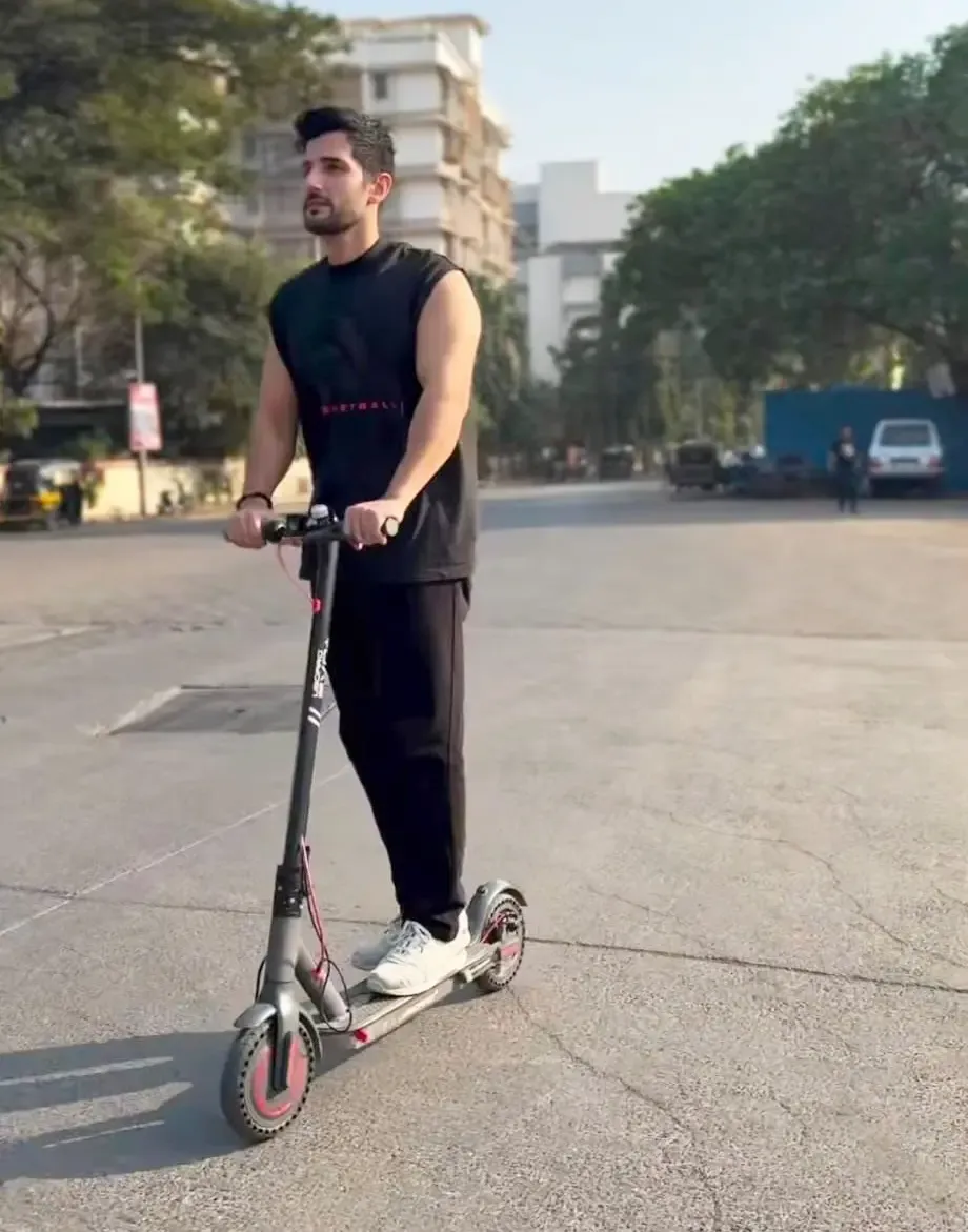 Aditya Seal takes e-scooter to work to reduce carbon footprint