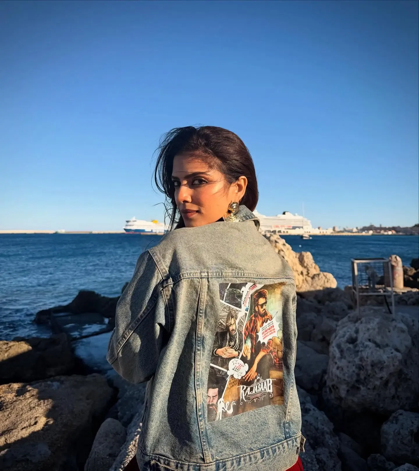 Is Actress Malavika Mohanan Sporting 'The Raja Saab' Poster in Greece?