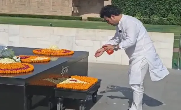BJP's Negi sprinkles Gangajal at Rajghat to 'purify' it after Kejriwal, Sisodia visit