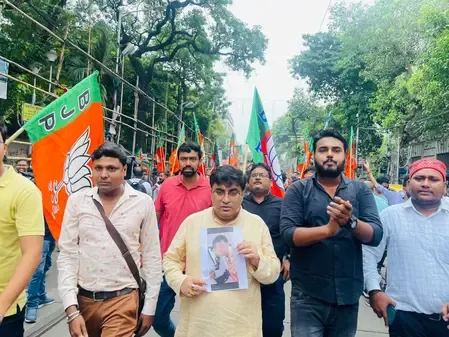 What prompted BJP workers to protest in Kolkata against the attack on MP Khagen Murmu?