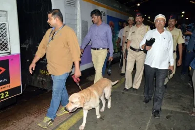 Why are bomb threats leading to increased security measures at courts and government offices across Gujarat?