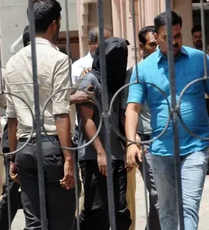 What Sentenced Two Income Tax Officials to Four Years' Imprisonment in 2015 Bribery Case?