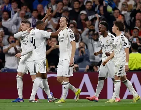 Champions League: Vinicius Jr. Leads Real Madrid to Last 16, Atalanta Knocks Out Dortmund