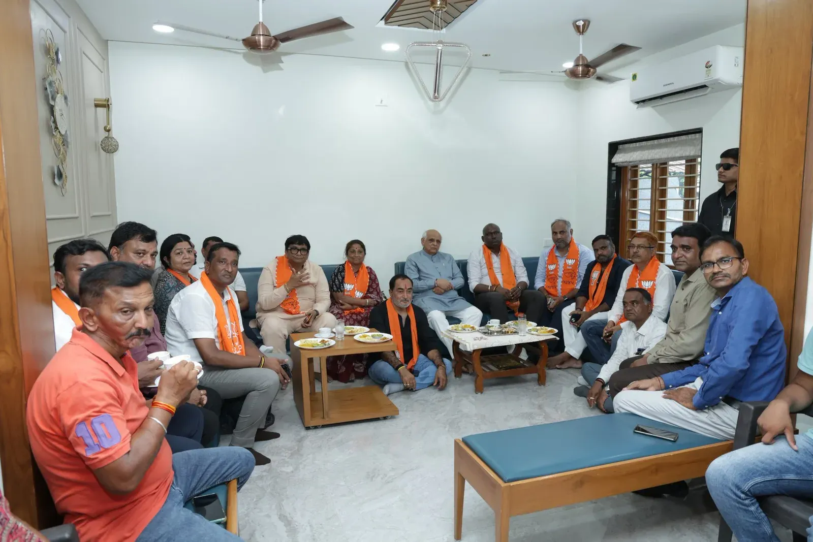 CM Bhupendra Patel watches Mann Ki Baat with Ghatlodia workers