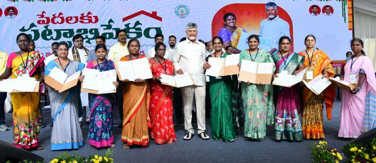 CM Chandrababu hands land titles to poor women in Vijayawada