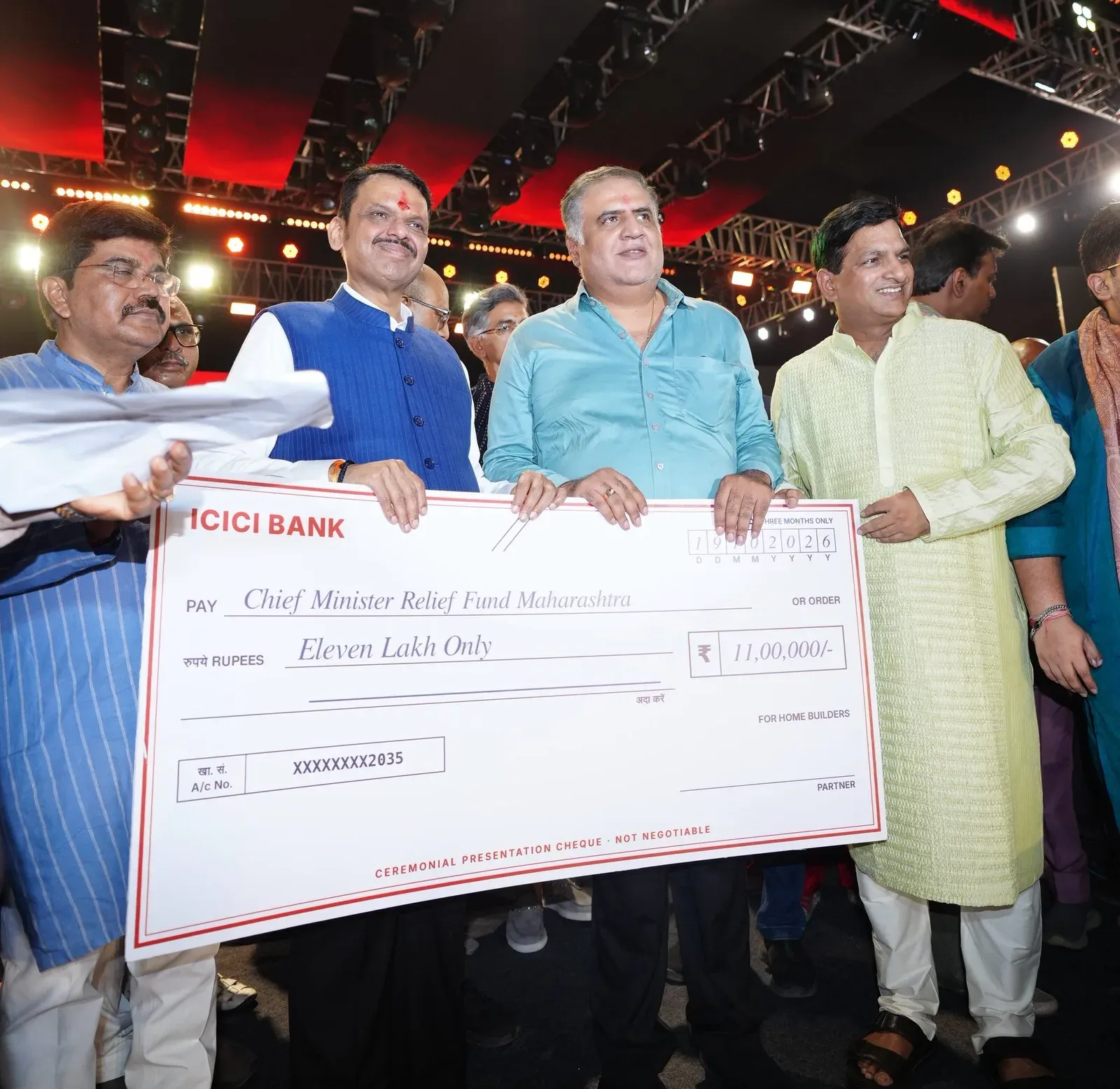CM Fadnavis receives ₹11 lakh cheque for drought-hit farmers