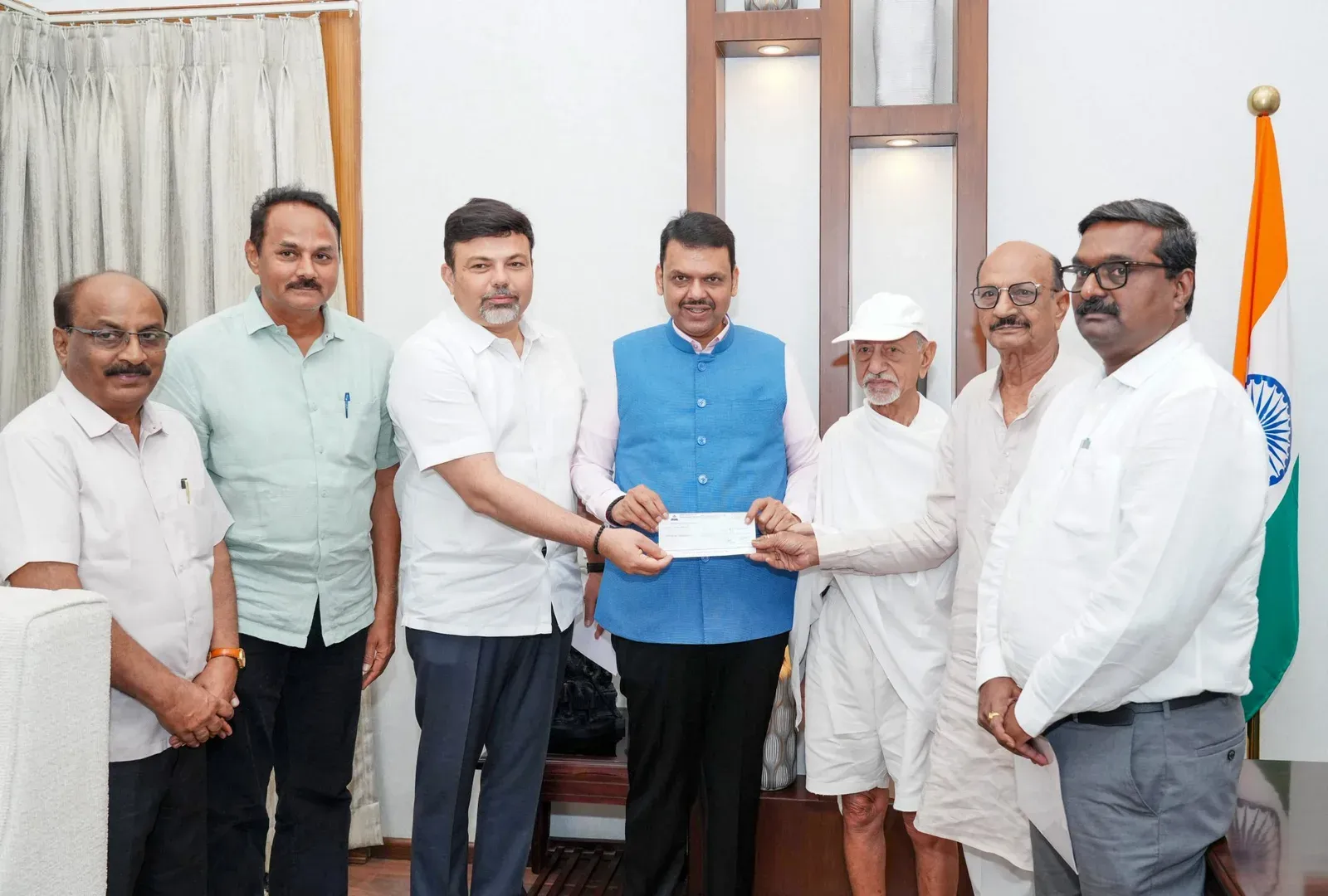 CM Fadnavis receives ₹80 lakh donation to Maharashtra Relief Fund