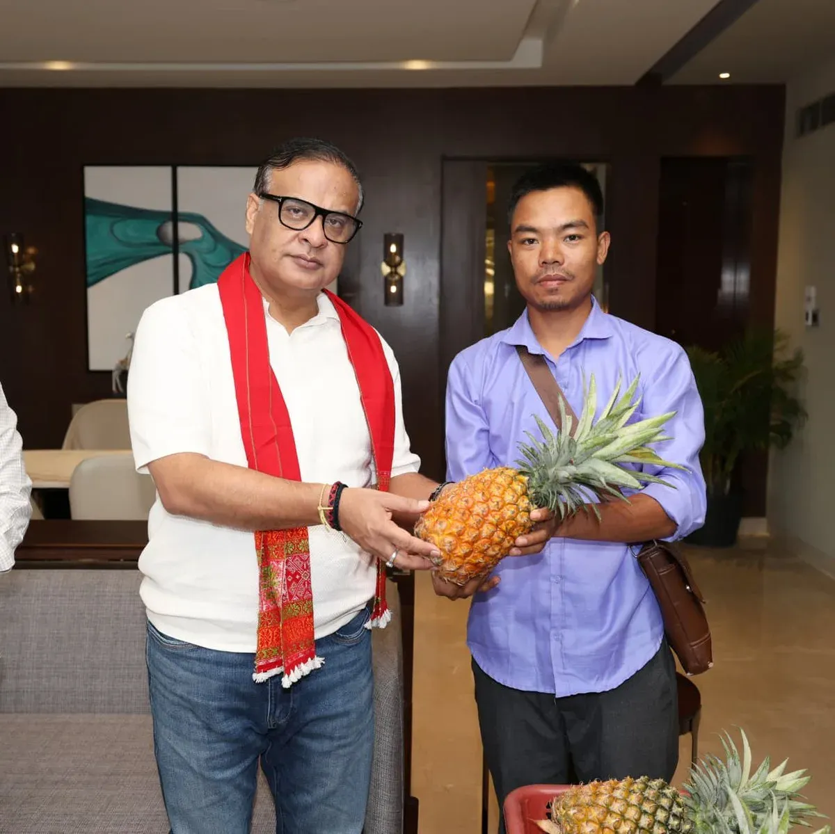 CM Himanta Receives Organic Assam Giant Queen Pineapples from Karbi Anglong Farmer
