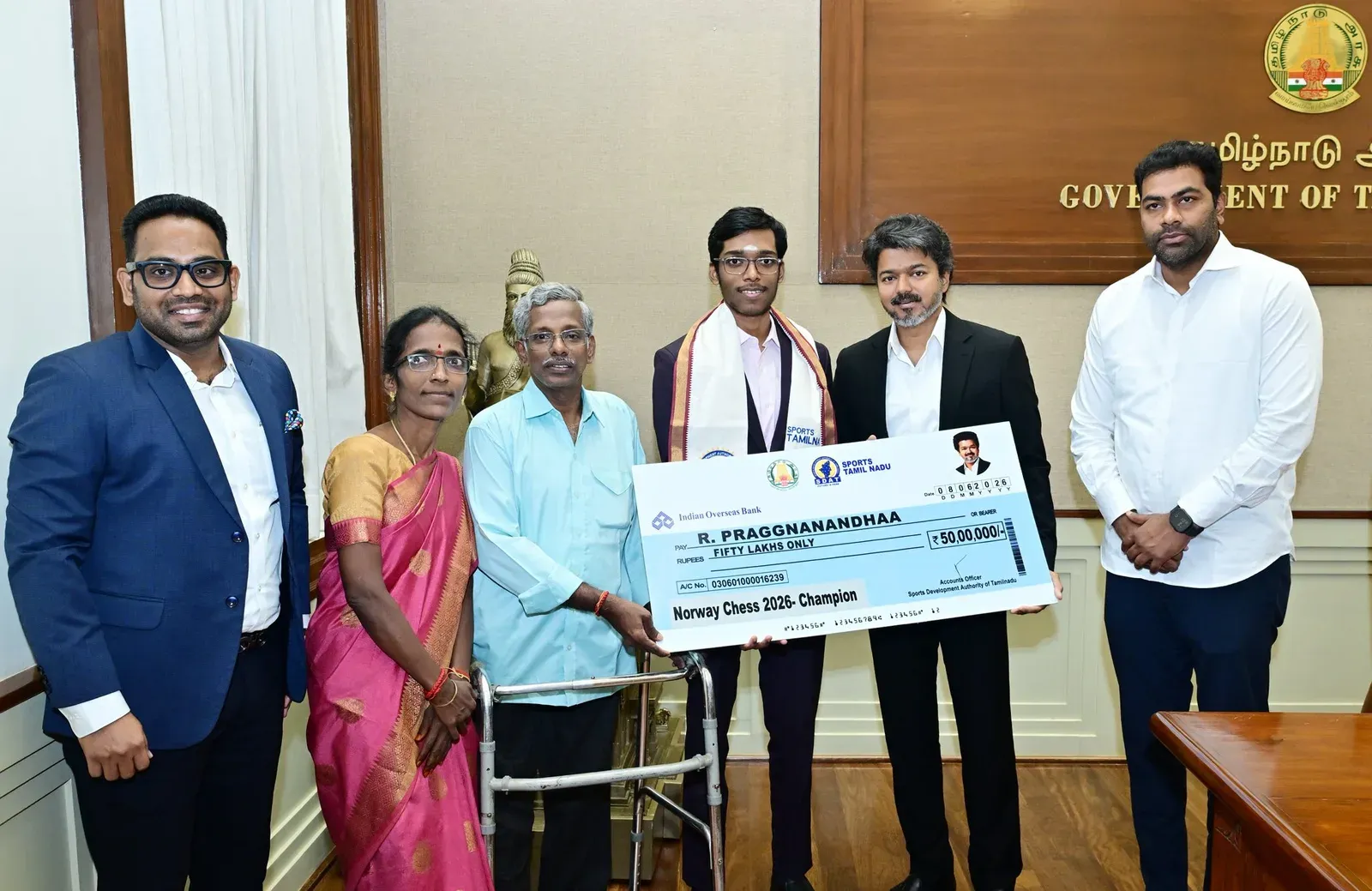 CM Vijay presents Rs 50 lakh cheque to Praggnanandhaa