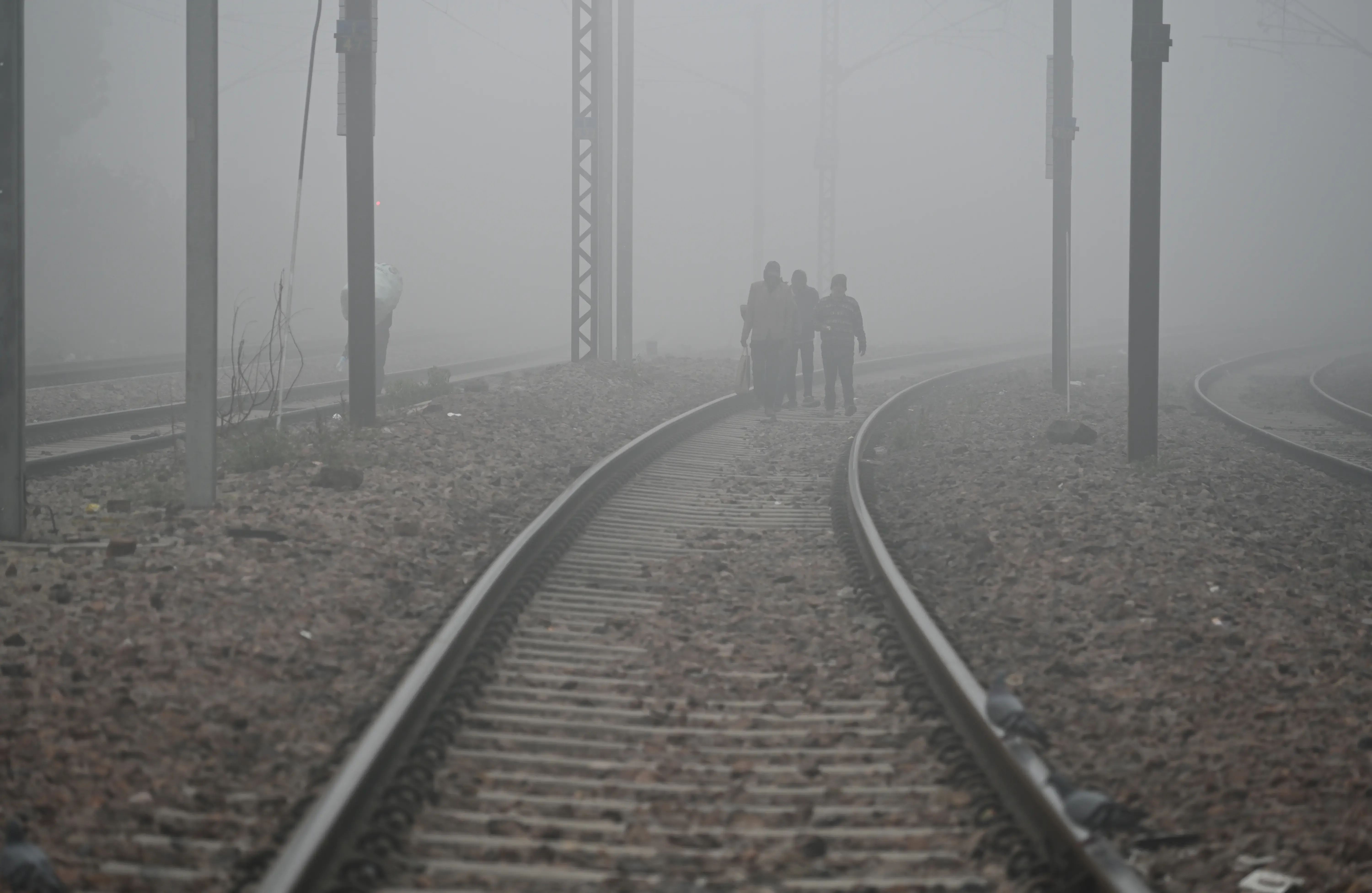 How is Dense Fog Disrupting Flights and Trains Across North India?
