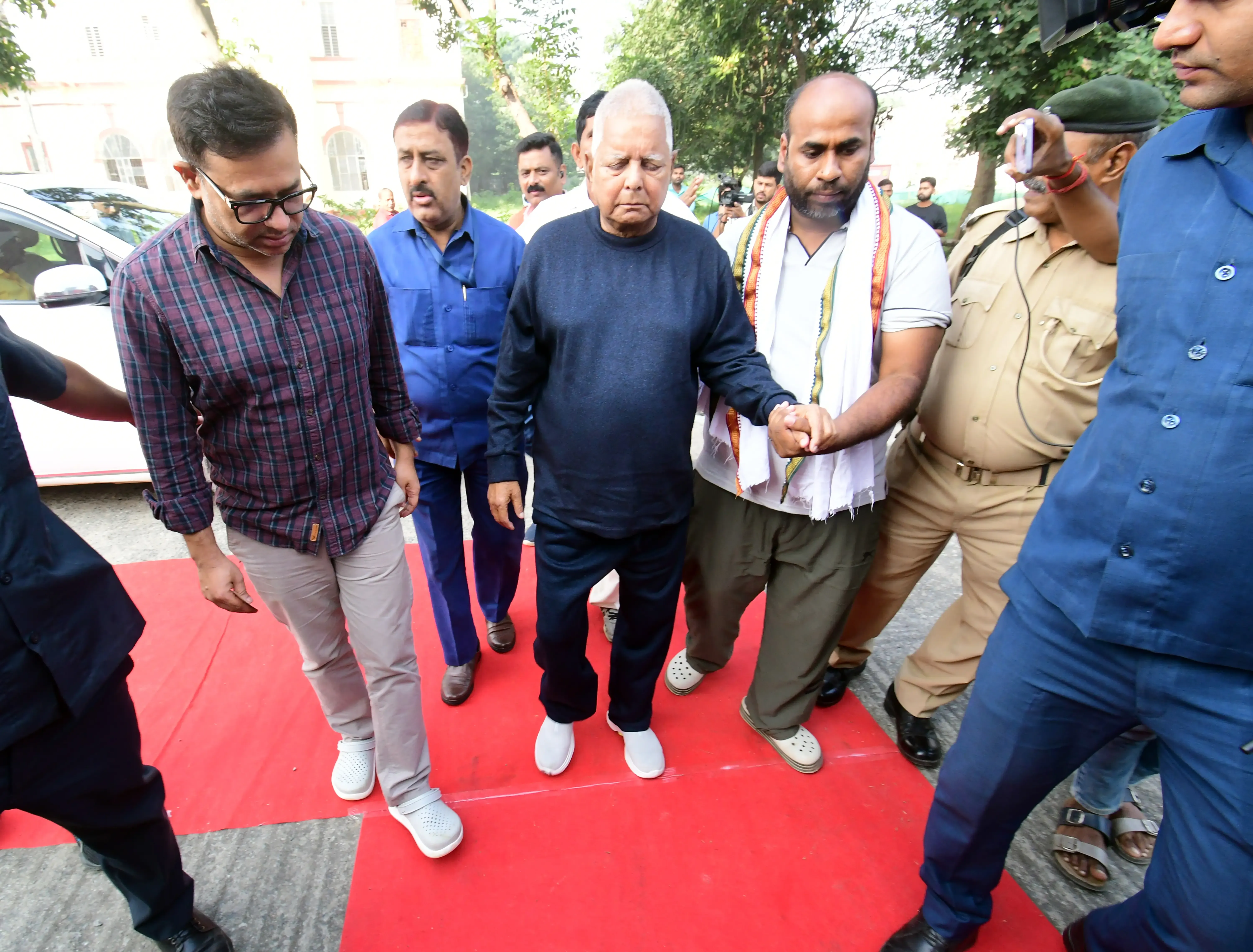 What Led to the Charges Against Lalu Prasad and His Family in the 'Land-for-Jobs' Case?