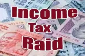 What prompted the I-T Department's raids across 40 locations in Gujarat?