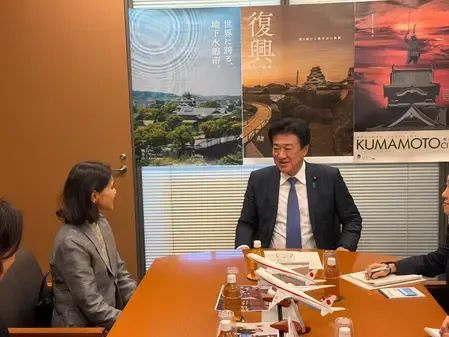 How are Indian envoy and Japan's Chief Cabinet Secretary working to strengthen bilateral ties?