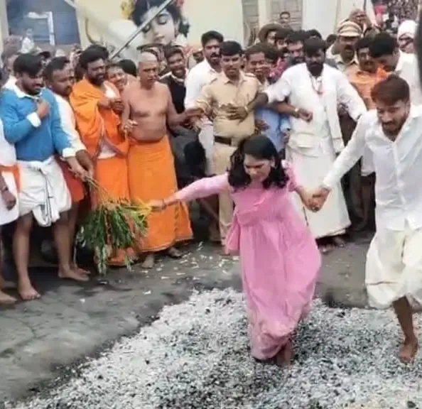 Did Karnataka's Deputy Commissioner Capture Hearts by Participating in a Fire-Walking Ritual?