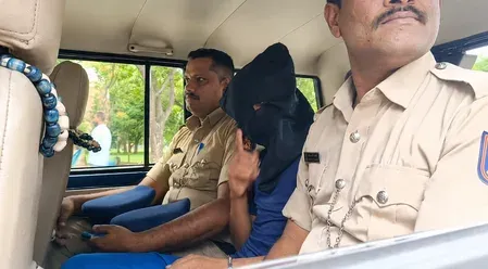 Karnataka terror suspect Suhail gestures at media during Davanagere hospital visit