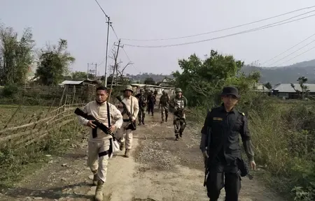 Why is there a manhunt in Manipur for armed cadres giving a gun salute?