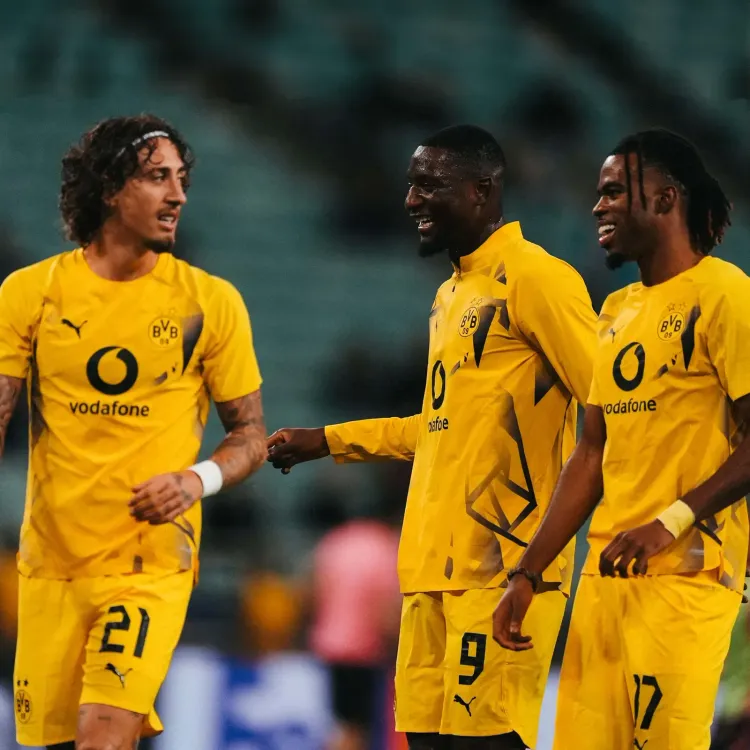 Beier's late curler sends Dortmund top of Bundesliga before Bayern showdown