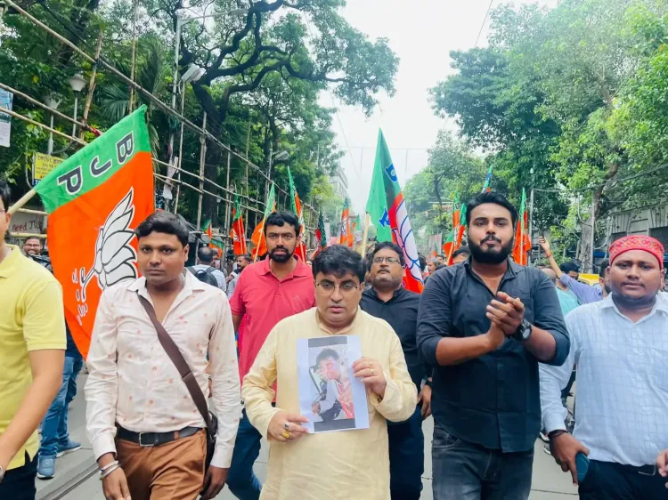 What prompted BJP workers to protest in Kolkata against the attack on MP Khagen Murmu?