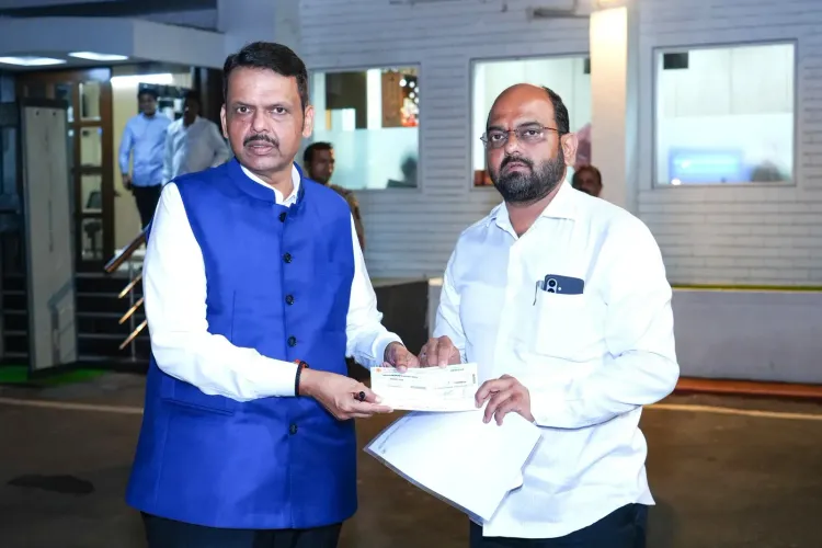 CM Fadnavis receives ₹10 lakh cheque for drought-hit farmers