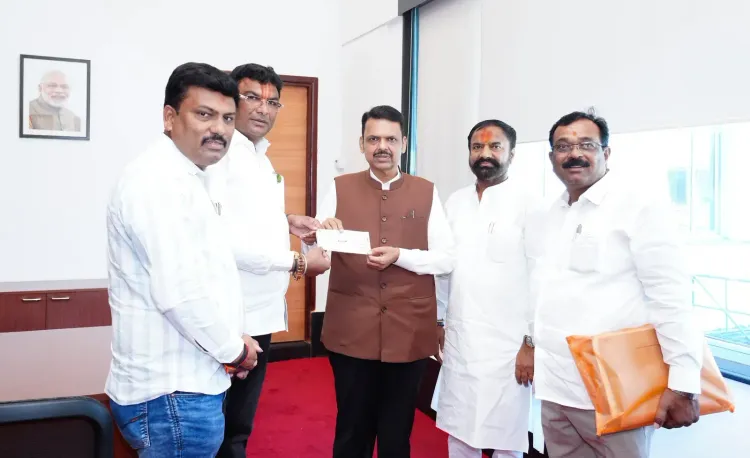 CM Fadnavis receives ₹1.51 lakh cheque for drought-hit farmers