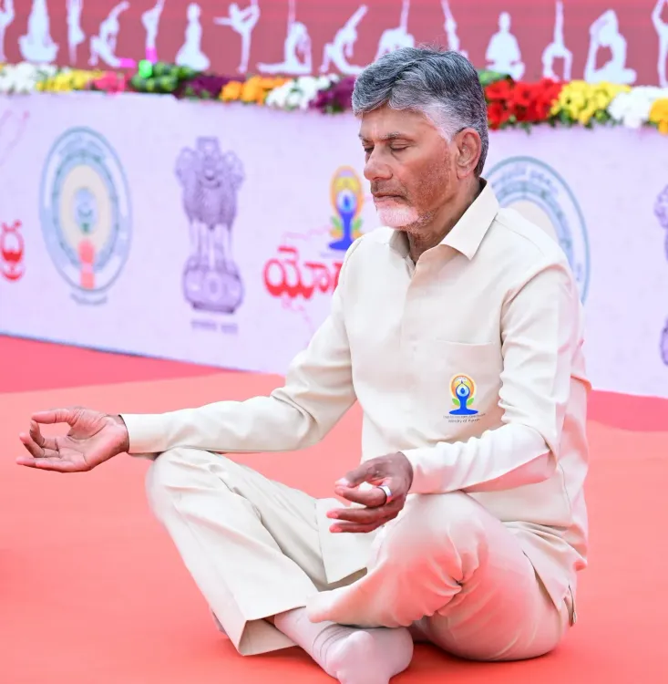 CM Naidu joins Yoga Day celebrations in Vijayawada with Ramdev