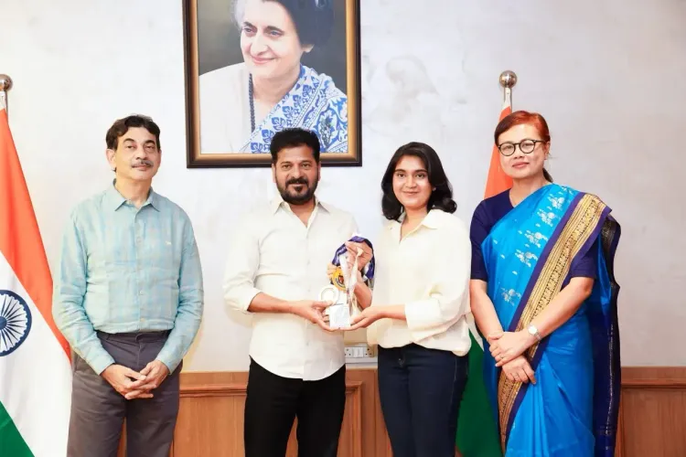 CM Revanth Reddy felicitates shooter Esha Singh at MCRHRD