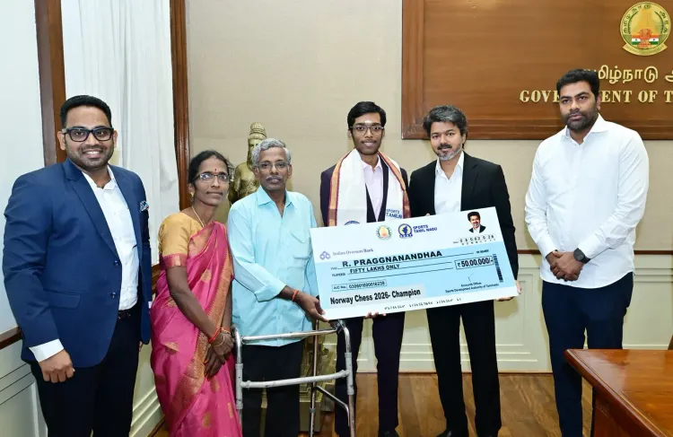 CM Vijay presents Rs 50 lakh cheque to Praggnanandhaa