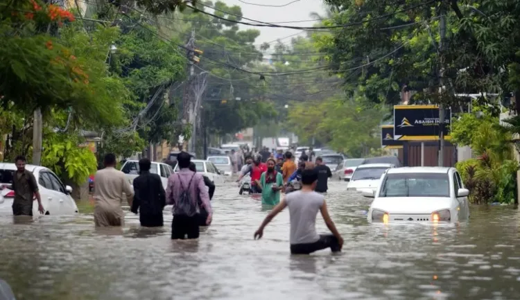 What led to the tragic deaths of eleven in Karachi due to rain?