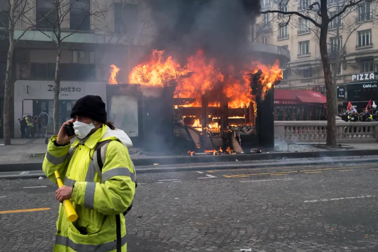 What led to the burning of over 1100 vehicles in France during New Year's Eve?