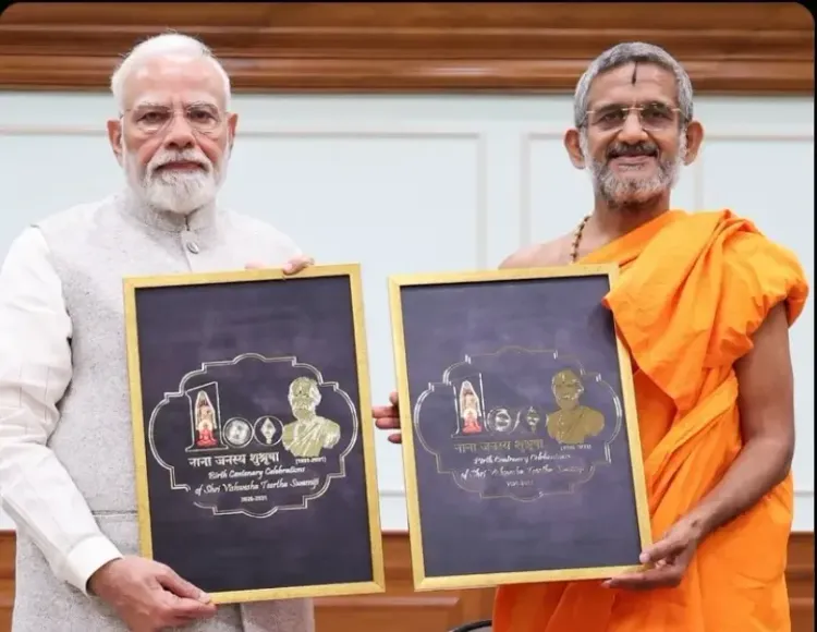 PM Modi unveils logo for Pejawar Math's Sri Vishwesha Tirtha Swamiji birth centenary