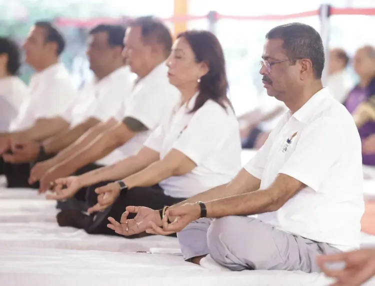 Pradhan joins yoga session at Delhi University South Campus
