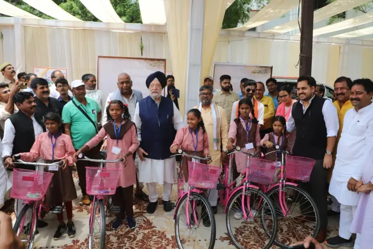 Puri Distributes Cycles to Girls, Hails Sonbhadra's Rise