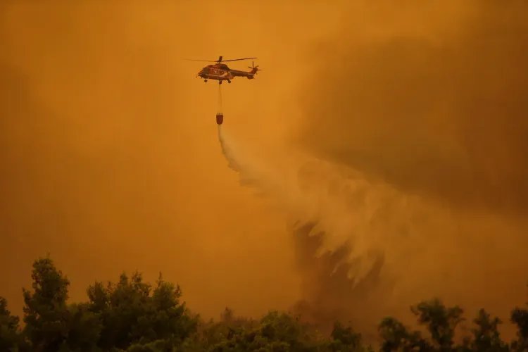 Two firefighting helicopters collide mid-air over Greece wildfire in Attica