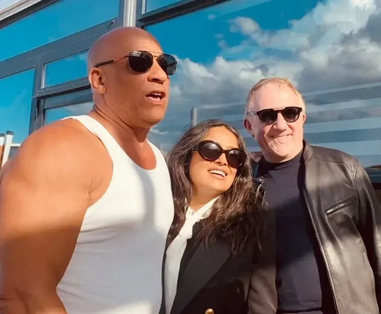 Vin Diesel poses with Salma Hayek and François-Henri Pinault at Cannes