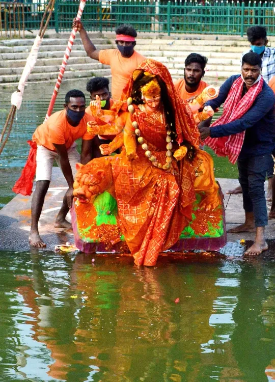 Is Security Being Enhanced at Ghats for Major Community Durga Puja Idol Immersion?