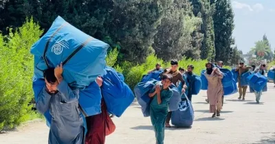 What is the situation for the nearly 1.2 million Afghans returning home from Pakistan since September 2023?