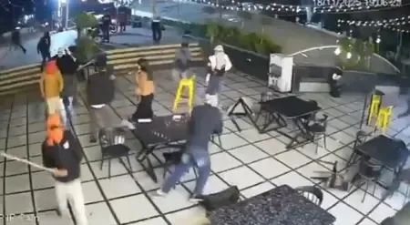 What Led to the Rampage by 20 Masked Men at a Bhopal Restaurant?
