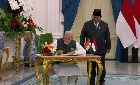 Modi signs guestbook at Istana Merdeka, holds talks with Prabowo Subianto