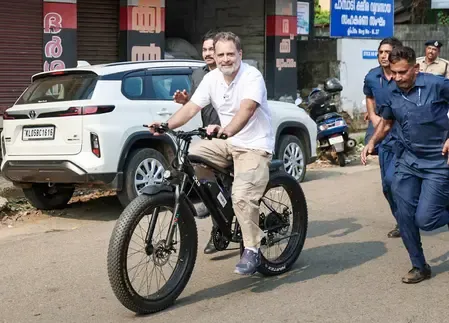Rahul Gandhi Rides Through Puthupally, Honoring Oommen Chandy's Legacy