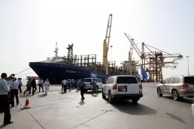 Did a Saudi-led coalition discover weapons in a shipment arriving at Mukalla port?