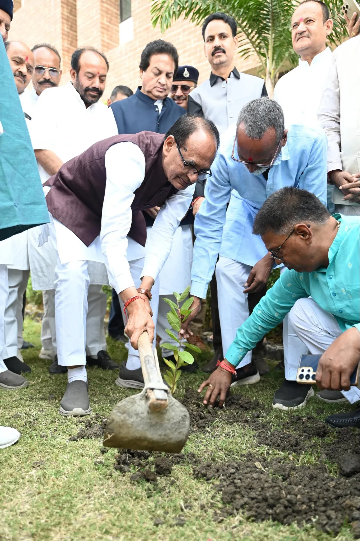 Shivraj plants sapling at RSETI women's credit event in Bhopal