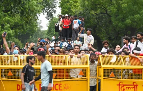 New Delhi: CJP supporters celebrate Dharmendra Pradhan's resignation