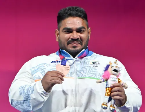 पोडियम पर झंडू कुमार — भारत का CWG 2026 में पहला पदक