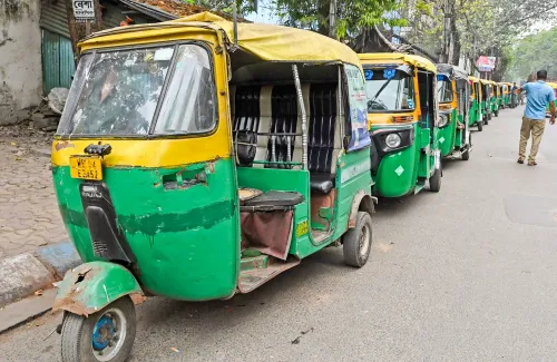 Auto rickshaws line up at fuel station in Kolkata