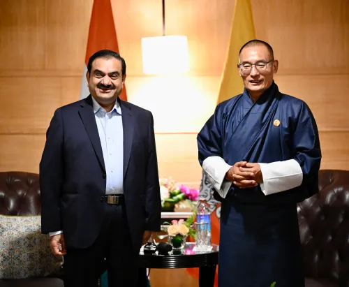 How are Adani Power and Druk Green Power Collaborating on a 570 MW Hydropower Project in Bhutan?