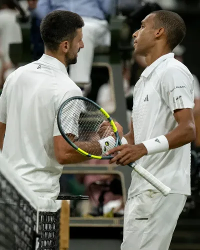 Auger-Aliassime falls to Djokovic in record Wimbledon QF thriller