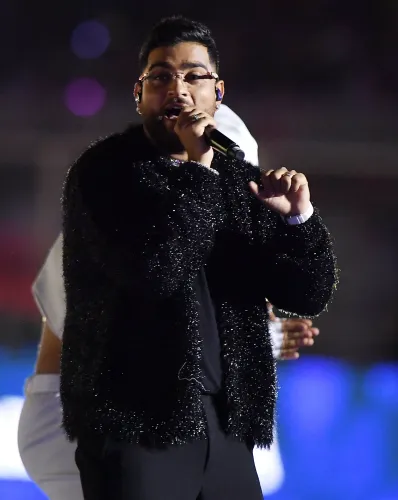 Is Karan Aujla's India Tour Extension Amid Controversy a Bold Move?