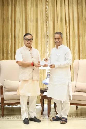Assam Min Ashok Singhal Donates to CM Relief Fund