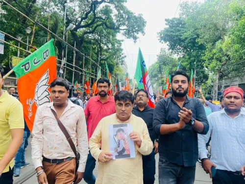 What prompted BJP workers to protest in Kolkata against the attack on MP Khagen Murmu?