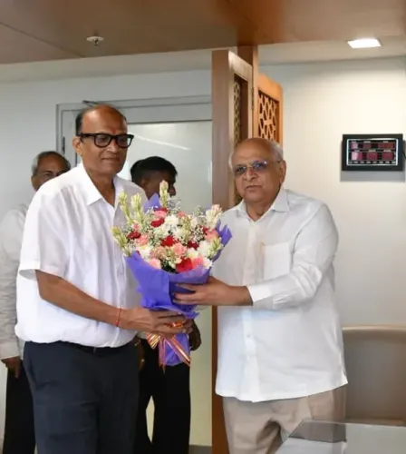 CM Bhupendra Patel congratulates Satishbhai Patel on swearing-in as Manjalpur MLA